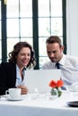 Business colleagues using a laptop while having a meeting Royalty Free Stock Photo