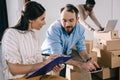 business colleagues working with clipboard during relocation Royalty Free Stock Photo