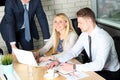 Business colleagues working together and analyzing financial figures on a graphs Royalty Free Stock Photo