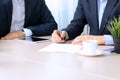 Business colleagues working together. Businessman is signing a contract Royalty Free Stock Photo