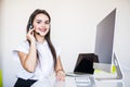 Business, communication, technology and call center concept - friendly female helpline operator with headphones and computer call Royalty Free Stock Photo