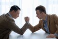 Business competition arm wrestling focused men hands Royalty Free Stock Photo