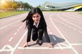 Business competition: businesswoman on start line and ready to reach the target Royalty Free Stock Photo