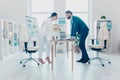 Business competition, full length side view profile of two colleagues in classic suits having disagreement and conflict, standing Royalty Free Stock Photo