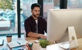 Business, computer and man working at a desk while online for research or creative work. Male entrepreneur person at Royalty Free Stock Photo