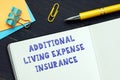 Business concept about ADDITIONAL LIVING EXPENSE INSURANCE with inscription on the bank form