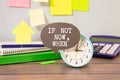 Business concept. The alarm clocks have a sticker with the inscription - If Not Now, When
