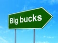 Business concept: Big bucks on road sign background