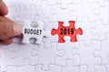 Business concept: 2019 BUDGET word on a jigsaw puzzle background