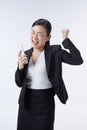 Business concept. Business women wear a black suit holding phone on her hands and feeling happy and smiling. Royalty Free Stock Photo