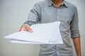 Business concept. Businessman holding white sheet of paper Royalty Free Stock Photo