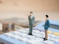 Business Concept. businessman small figures standing on calcula Royalty Free Stock Photo