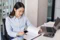 Business concept, Businesswoman read financial data on document to analyze investment for project