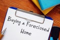 Business concept about Buying a Foreclosed Home with phrase on the page