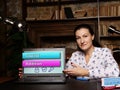 Business concept about Capital Addition with inscription. Young businesswoman reading paperwork at desk in office on background