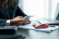 Business concept, car insurance, sell and buy car, car financing, car key for vehicle sales agreement. A car dealer is explaining Royalty Free Stock Photo