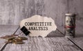 Business concept. On the business charts is a pen and a sign with the inscription - Competitor Analysis Royalty Free Stock Photo