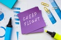 Business concept about CHEAP FLIGHT with sign on the piece of paper