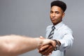 Business concept - Close-up of two confident business people shaking hands during a meeting. Royalty Free Stock Photo