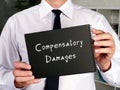 Business concept about Compensatory Damages with sign on the piece of paper
