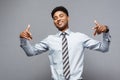 Business Concept - Confident happy young African American pointing two hands to himself. Royalty Free Stock Photo