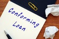 Business concept about Conforming Loan with inscription on the piece of paper