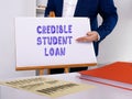 Business concept about CREDIBLE STUDENT LOAN with sign on the page