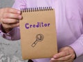 Business concept about Creditor with phrase on the page