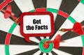 On the darts are darts and a sign with the inscription - Get the Facts