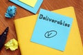 Business concept about Deliverables with inscription on the piece of paper