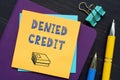 Business concept about DENIED CREDIT with inscription on the sheet