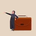 Business concept design Arabian businesswoman leaning on leather huge briefcase and pointing forward. Female manager standing with