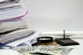 Business concept. Different documents, coins, dollars and a calculator. White background.