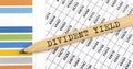 Business concept. DIVIDENT YIELD text on the pencil on chart background Royalty Free Stock Photo