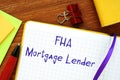 Business concept about FHA Mortgage Lender with inscription on the piece of paper