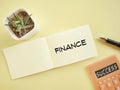 Business Concept - FINANCE text written on notepaper background. Stock photo. Royalty Free Stock Photo