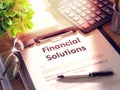 Financial Solutions - Title on Clipboard. 3D Render.