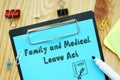 Business concept about FMLA Family And Medical Leave Act with sign on the page Royalty Free Stock Photo
