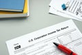 Business concept about Form 1120 U.S. Corporation Income Tax Return with sign on the page