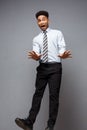 Business Concept - Full length portrait of successful african american businessman surprising jump in the office. Royalty Free Stock Photo