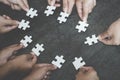 Business concept, Group of business people assembling jigsaw puzzle and represent team support and help togethe