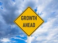 Business concept growth ahead road sign on blue cloudy sky Royalty Free Stock Photo