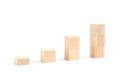 Wooden blocks stacking as an arrow up averages as a growth graph chart Royalty Free Stock Photo