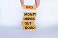 Business concept growth success process. Wood blocks on white background, copy space. Businessman hand. Words `bad money drives Royalty Free Stock Photo