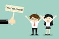 Business concept, Hand holding banner `You`re hired` to businessman and business woman.