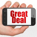 Business concept: Hand Holding Smartphone with Great Deal on display