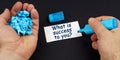 In the hands of crumpled paper, a marker, next to a business card with the inscription - What is success to you Royalty Free Stock Photo