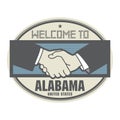 Business concept with handshake and the text Welcome to Alabama, United States