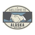Business concept with handshake and the text Welcome to Alaska,