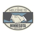 Business concept with handshake and the text Welcome to Minnesota, United States